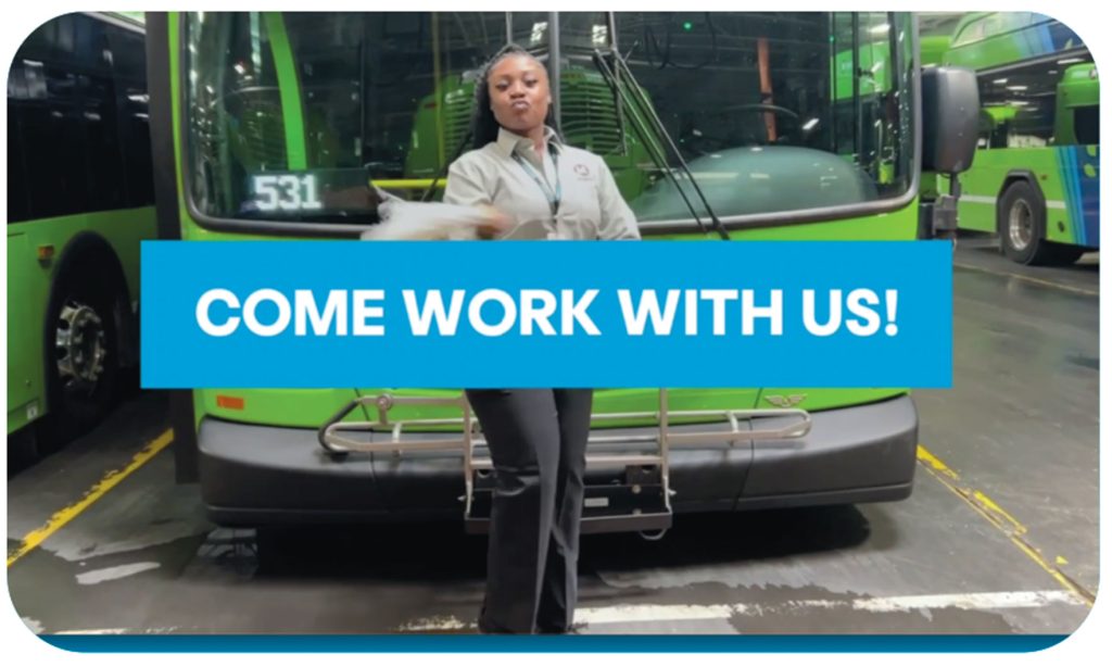 A Metro bus driver in front of a bus with the caption Come Work With Us.