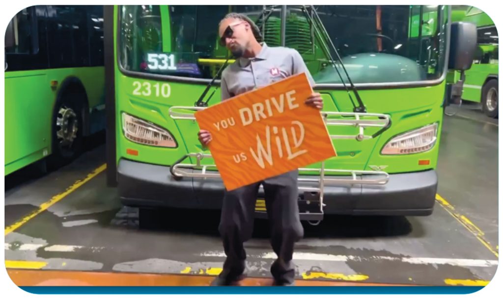 A Metro bus driver in front of a bus with the caption You Drive Us Wild.