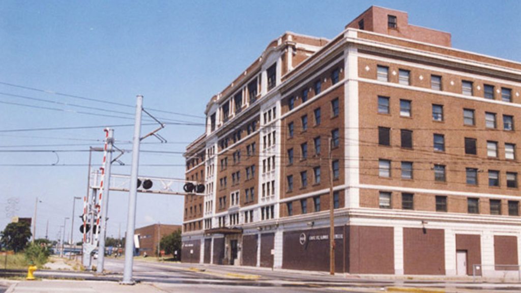 Fifth and Missouri Station with building and tracks.