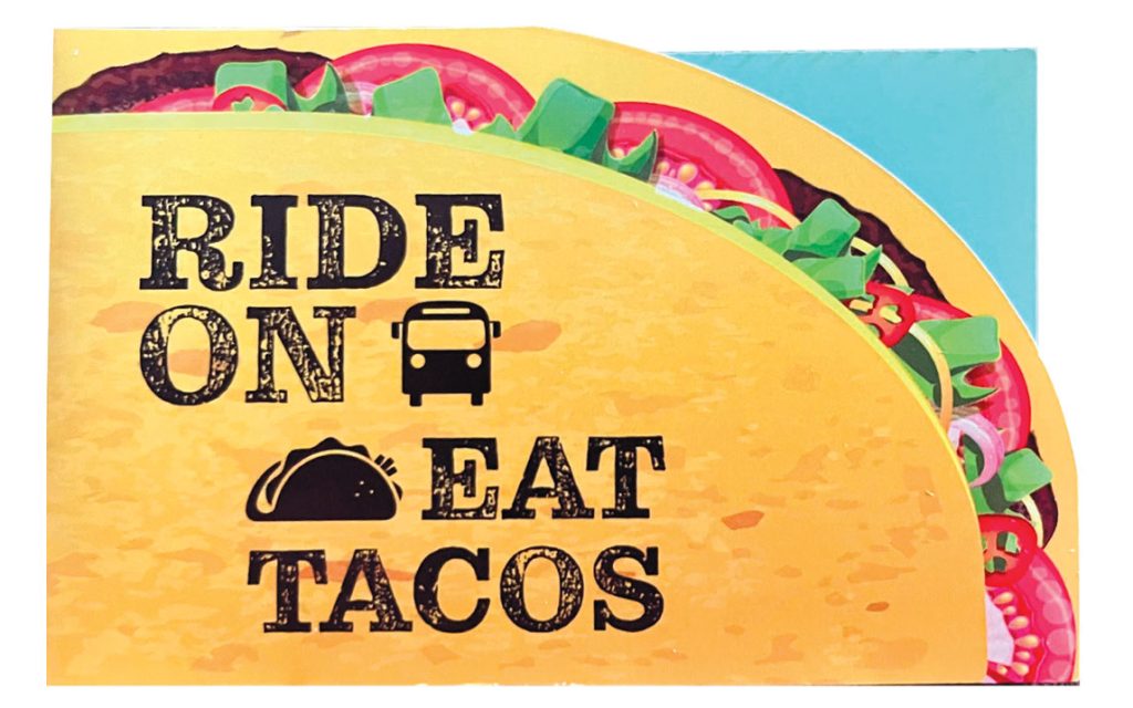 A graphic of a taco with the caption Ride On Eat Tacos.